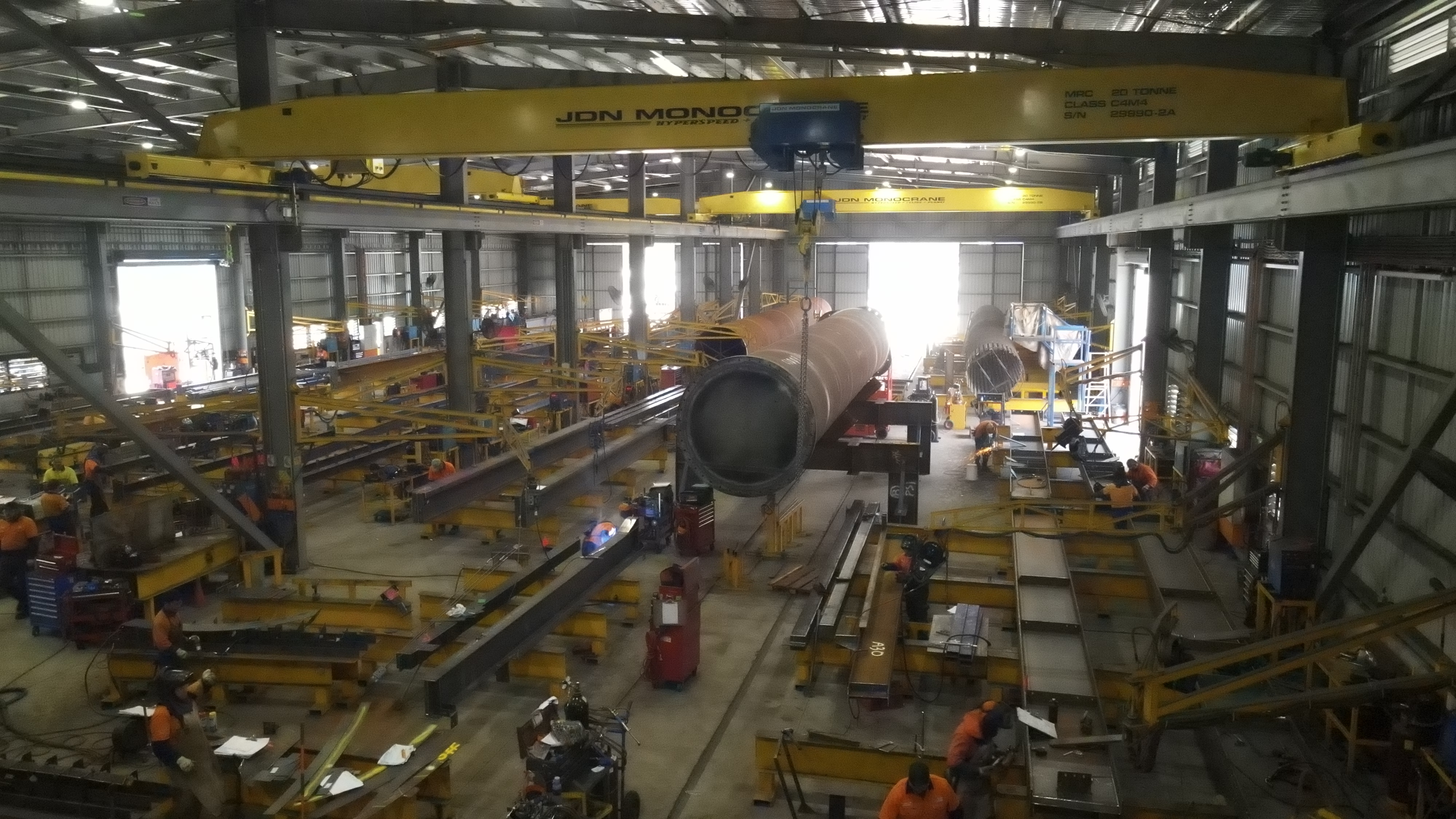 Beenleigh Steel Fabrications workshop — overhead crane lifting steel at Berrinba facility